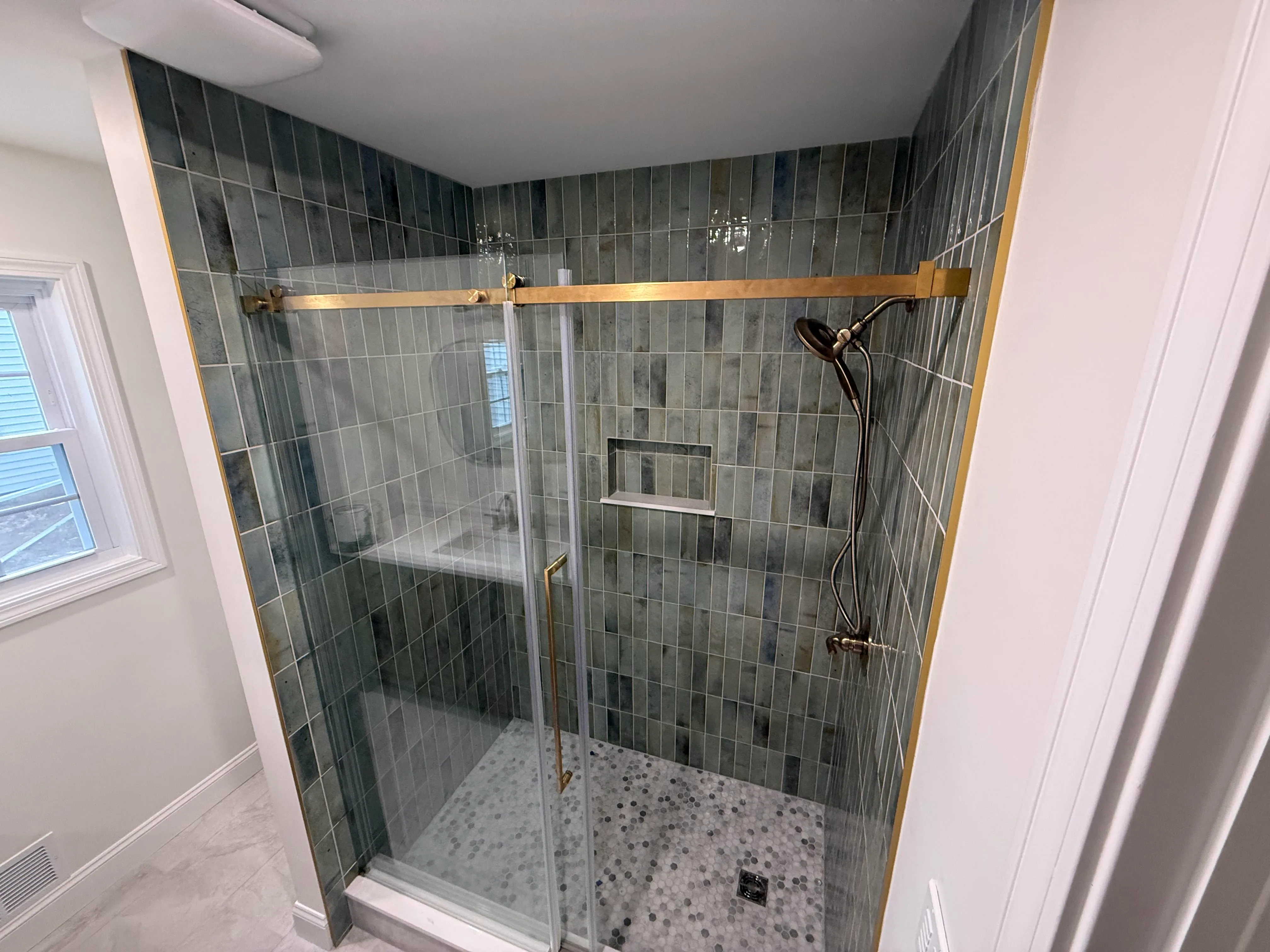 Custom tile shower with modern fixtures