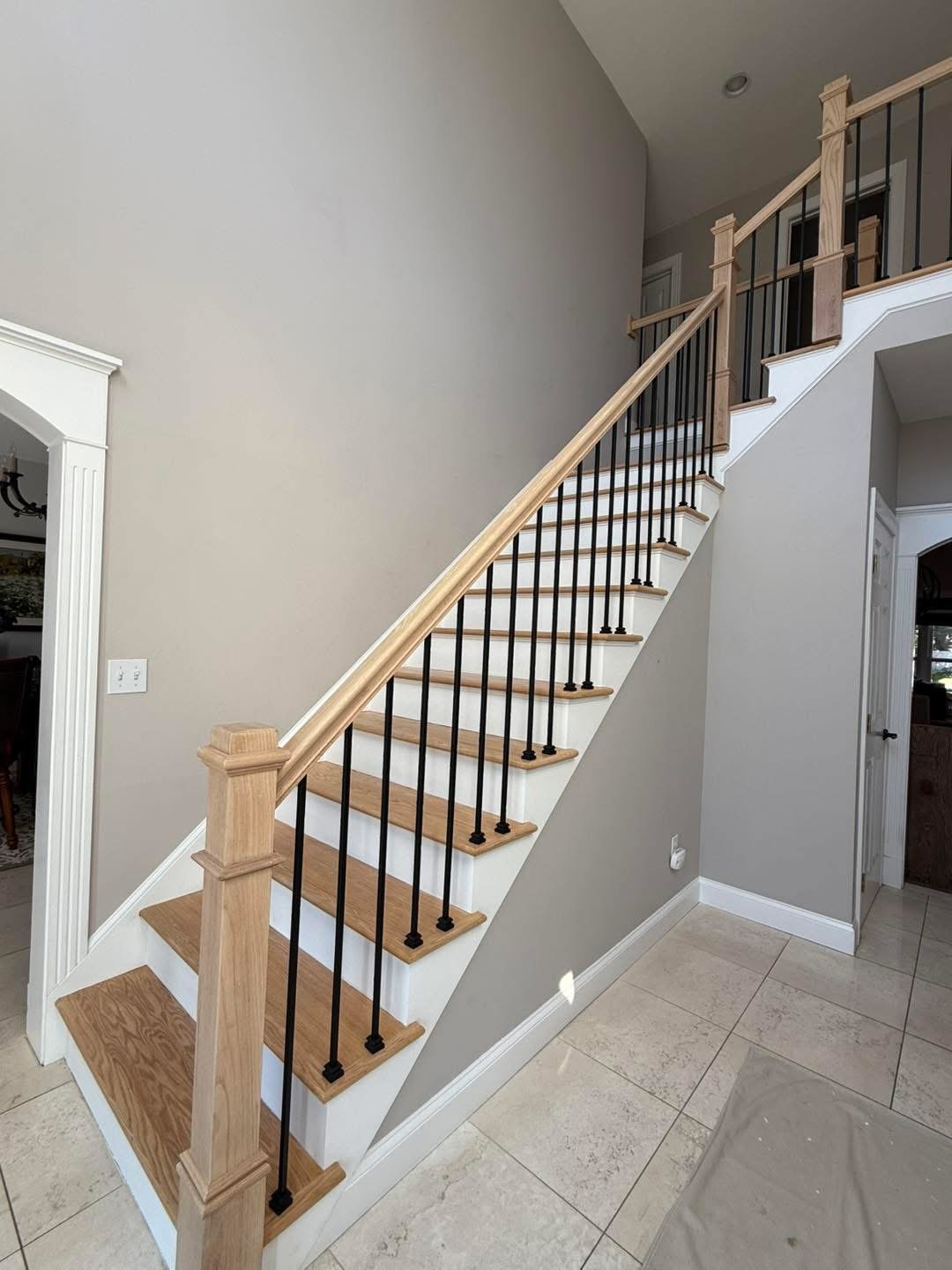 Staircase after refinishing, newel post and railing detail